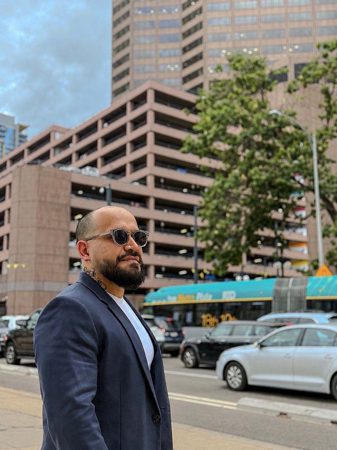 Yetro in the city wearing a blazer