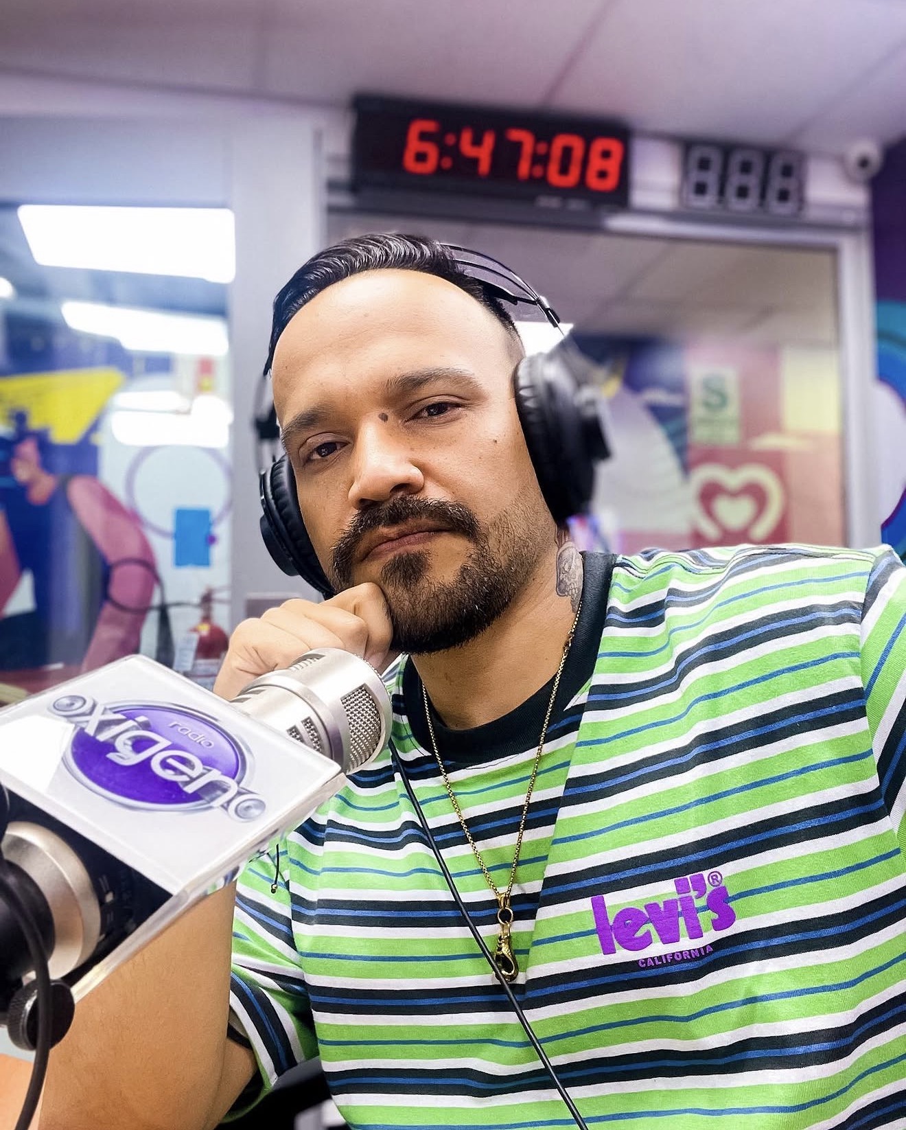 Yetro at a radio microphone in studio